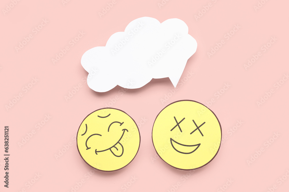 Paper faces with blank speech bubble on pink background