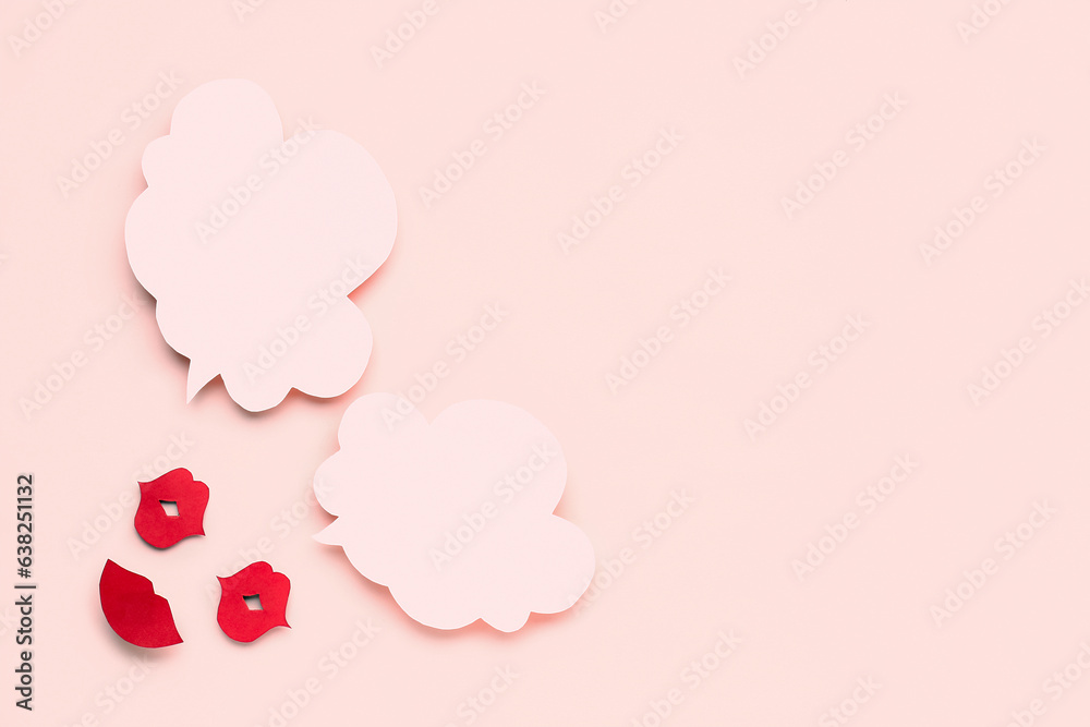 Paper lips with blank speech bubbles on pink background