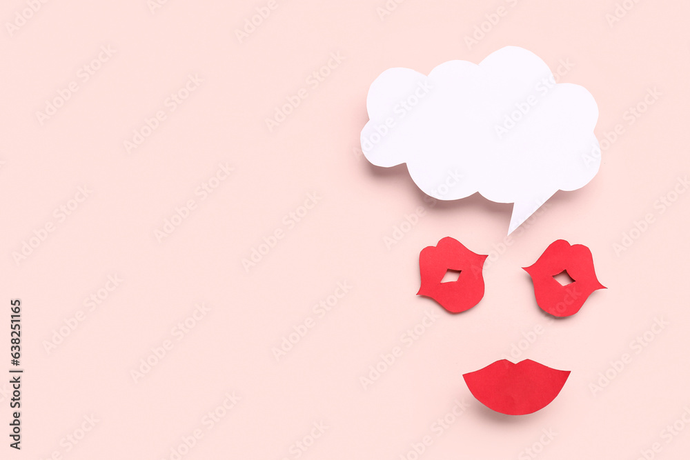 Paper lips with blank speech bubble on pink background