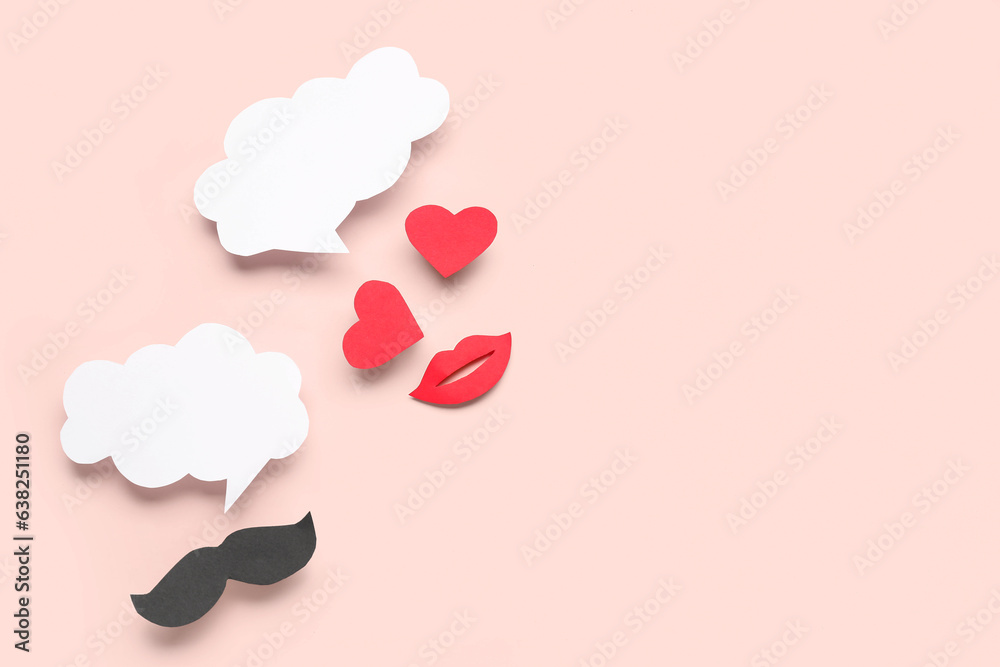 Paper mustache, lips and hearts with blank speech bubbles on pink background