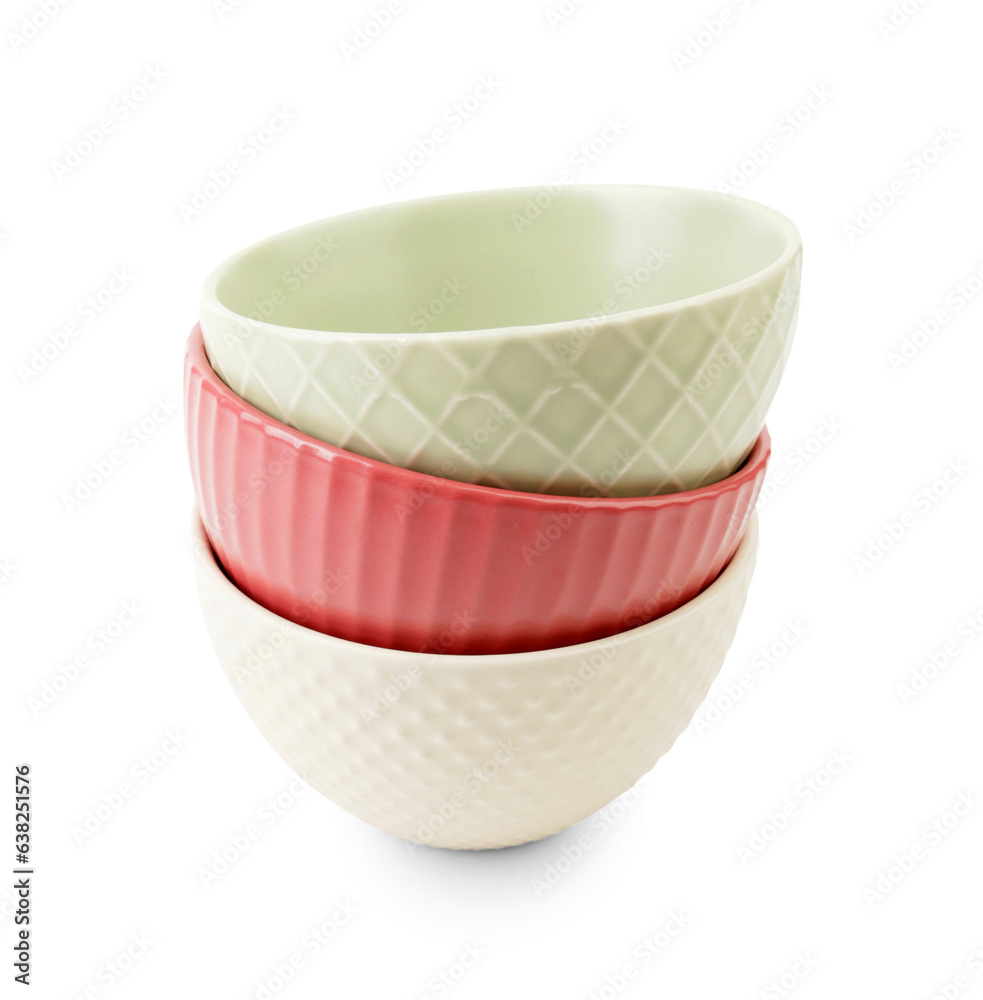 Set of color bowls on white background