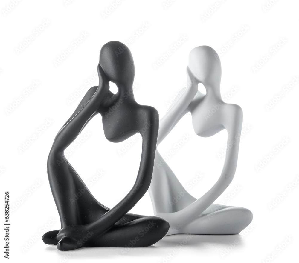 Statuettes in form of woman body on white background