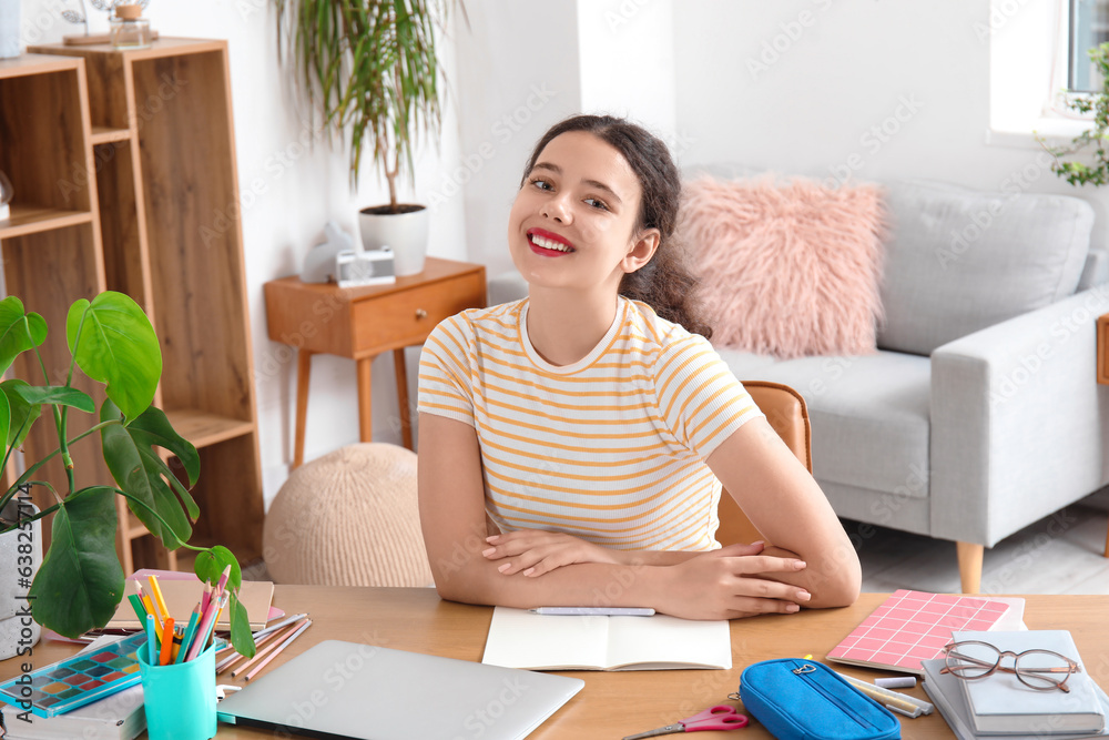 Female student doing lessons at home