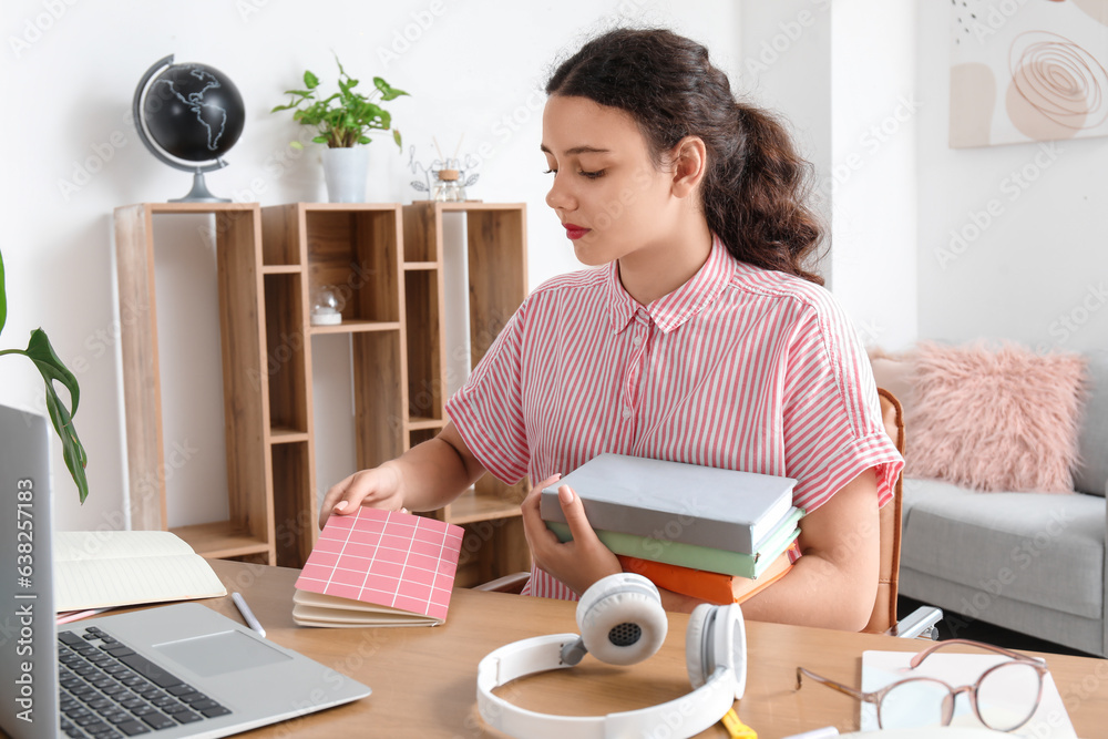 Female student doing lessons at home