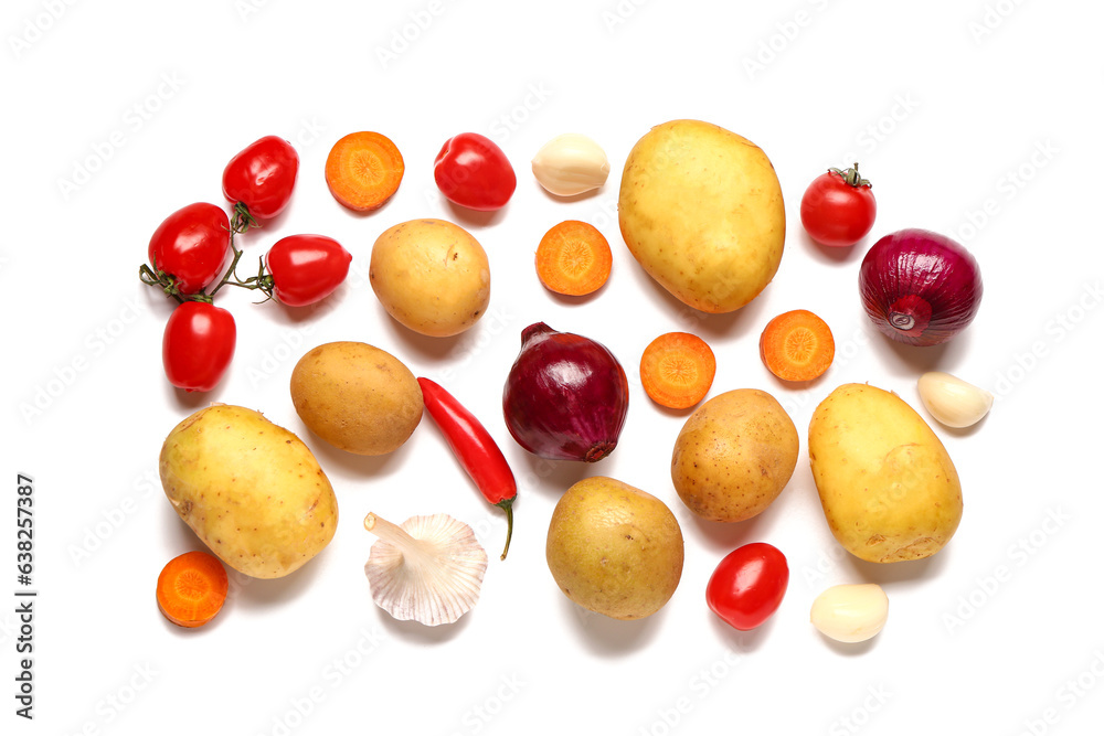 Potatoes with onion, garlic and cherry tomatoes on white background