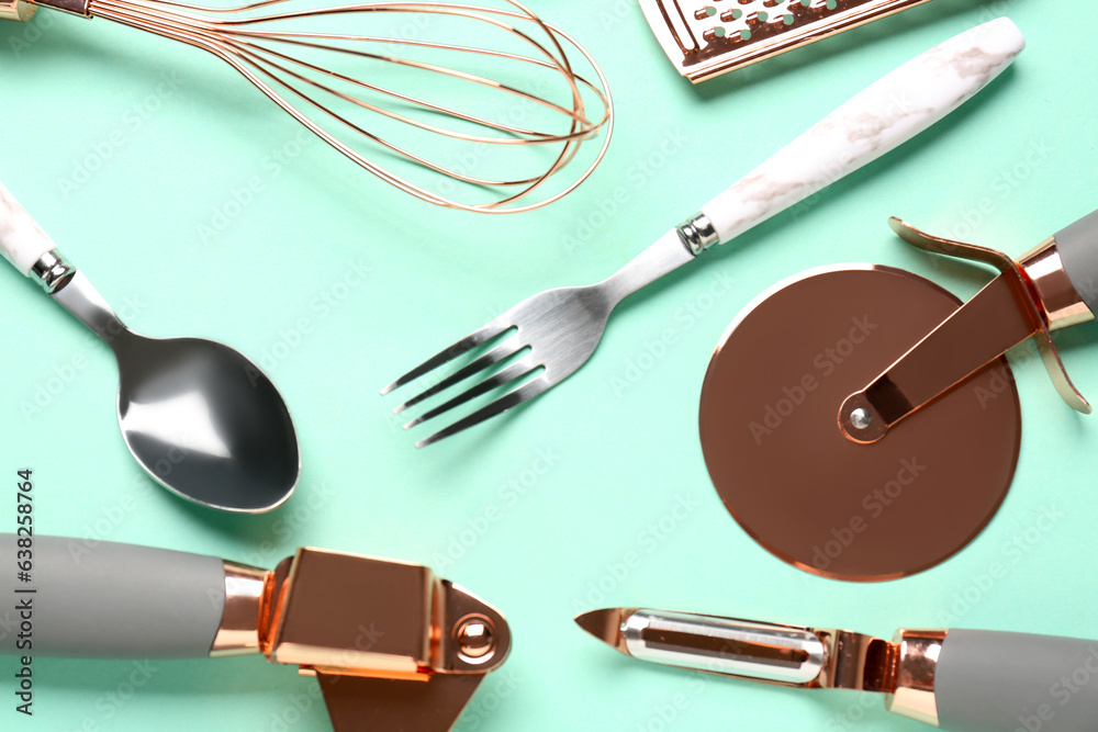 Set of kitchen utensils on turquoise background