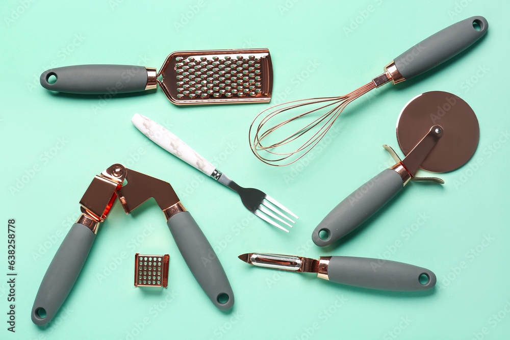 Set of kitchen utensils on turquoise background