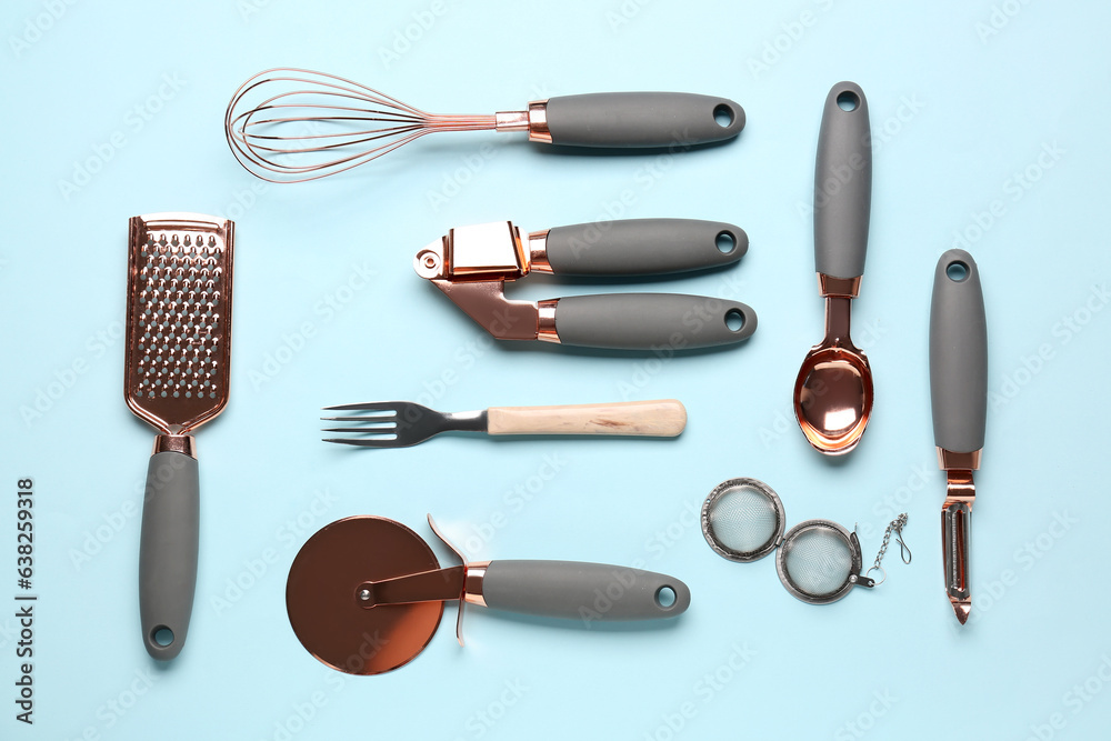 Set of kitchen utensils on light blue background