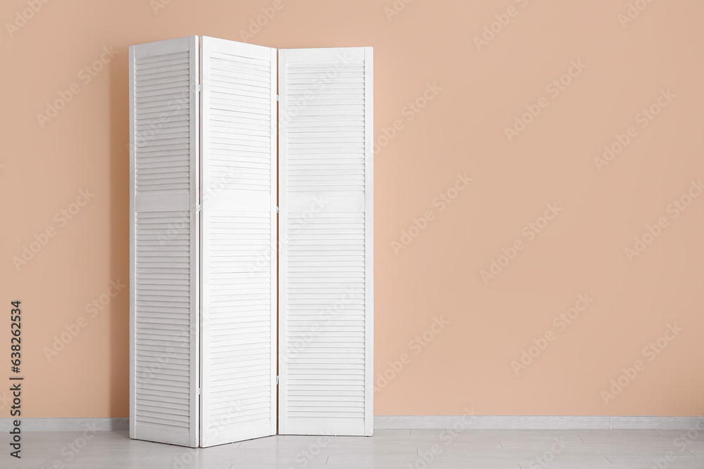 Folding screen near beige wall