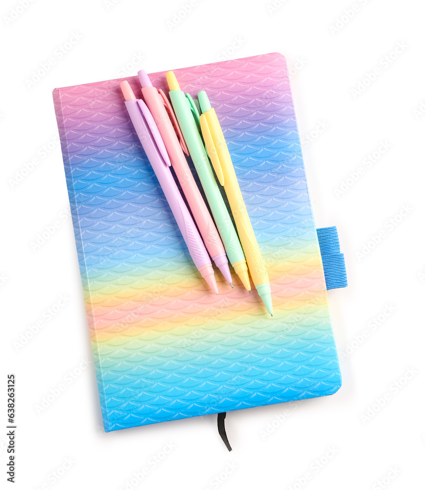 Colorful notebook and pens on white background