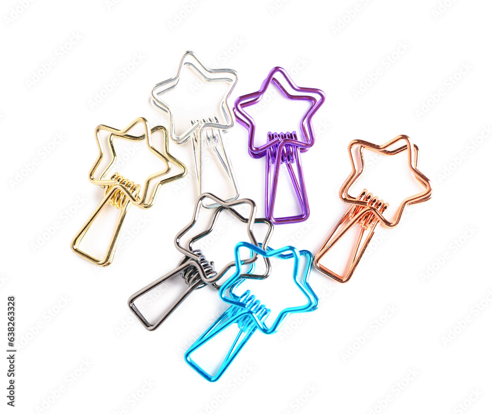 Colorful binder clips in shape of stars on white background