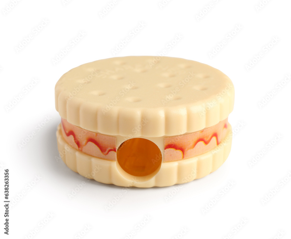 Cute sharpener in shape of cookie on white background