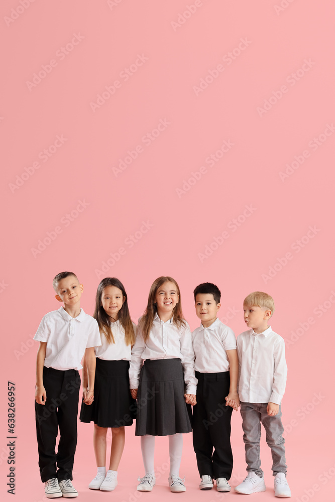 Little school children on pink background