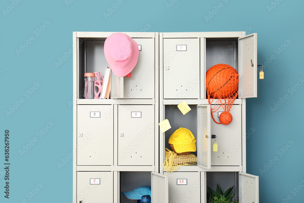 Modern locker with things near blue wall