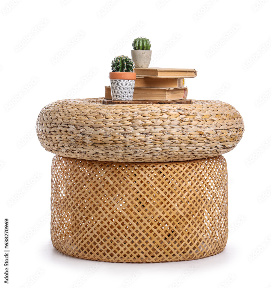 Wicker pouf with cacti and books isolated on white background