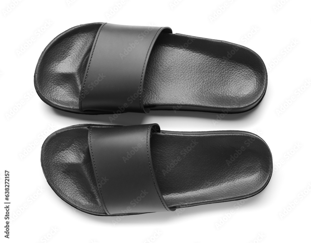 Black female flip flops on white background