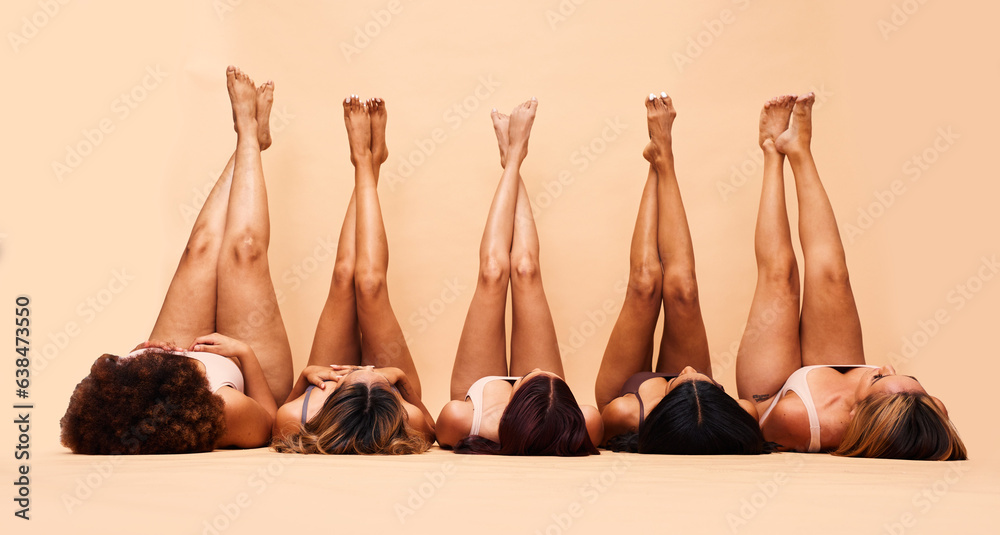 Skincare, diversity and legs of women in studio for care, comparison and wellness on wall background