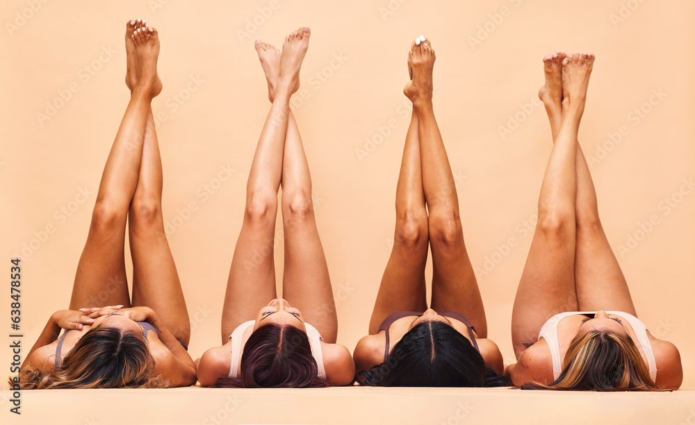 Diversity, skincare and legs of women in studio for beauty, comparison or wellness on wall backgroun