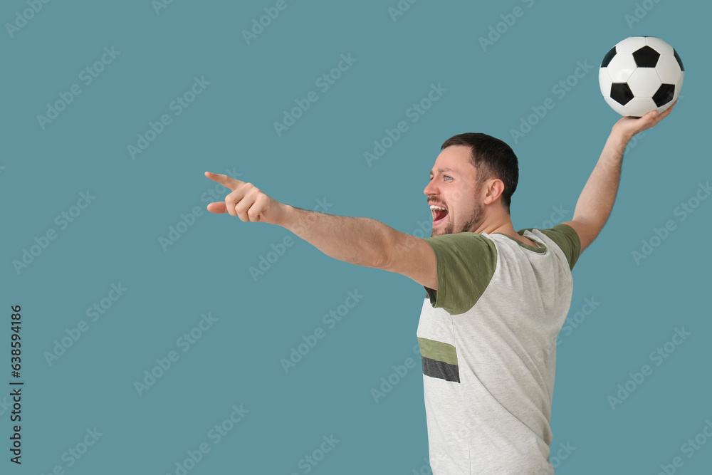 Screaming man with soccer ball on blue background