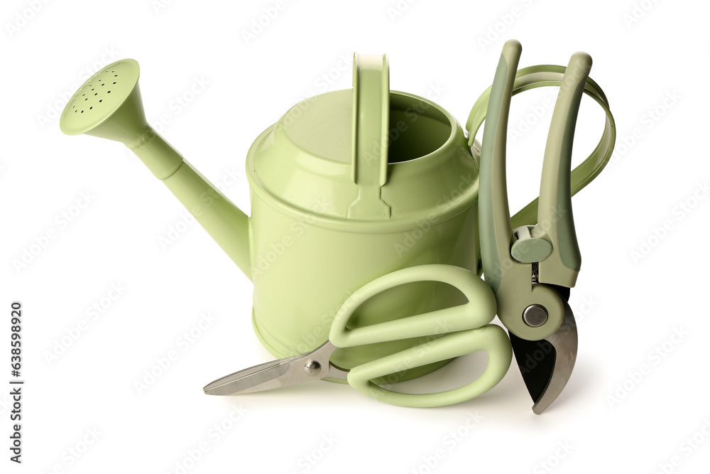 Watering can with floral scissors and secateurs on white background