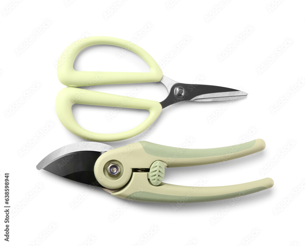 Floral scissors and secateurs with green handle on white background