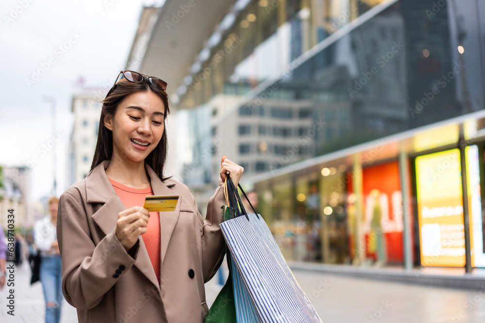 Asian beautiful woman shopping goods outdoor alone in department store. 