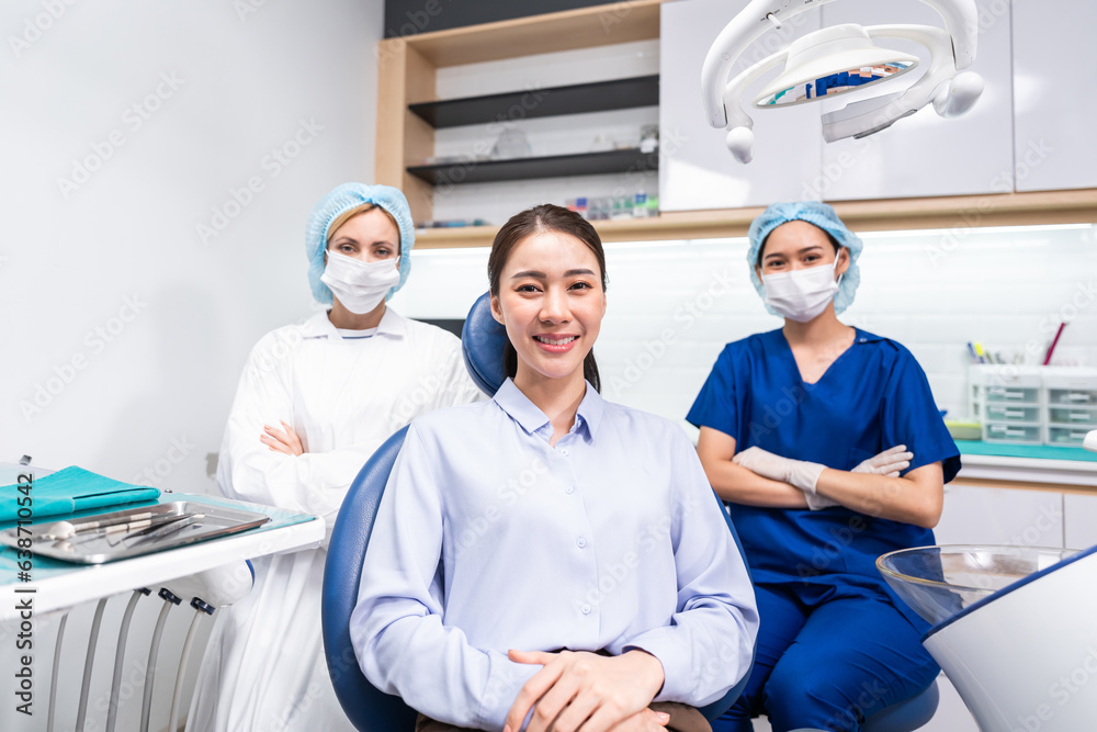 Portrait of Asian young woman patient and dentist at health care clinic. 