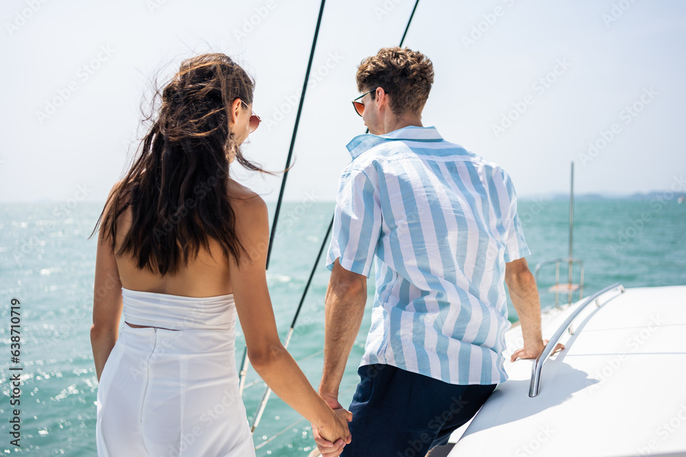 Caucasian romantic couple looking at beautiful view during yachting. 