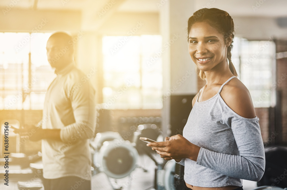 Fitness, gym and portrait of a woman with a phone for communication, internet and workout app. Happy