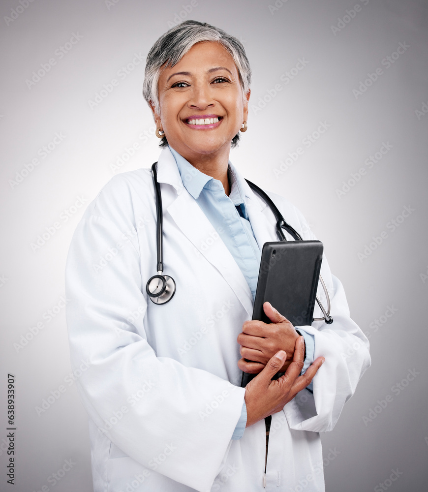 Tablet, happy woman and portrait of doctor in studio for healthcare services, telehealth support and