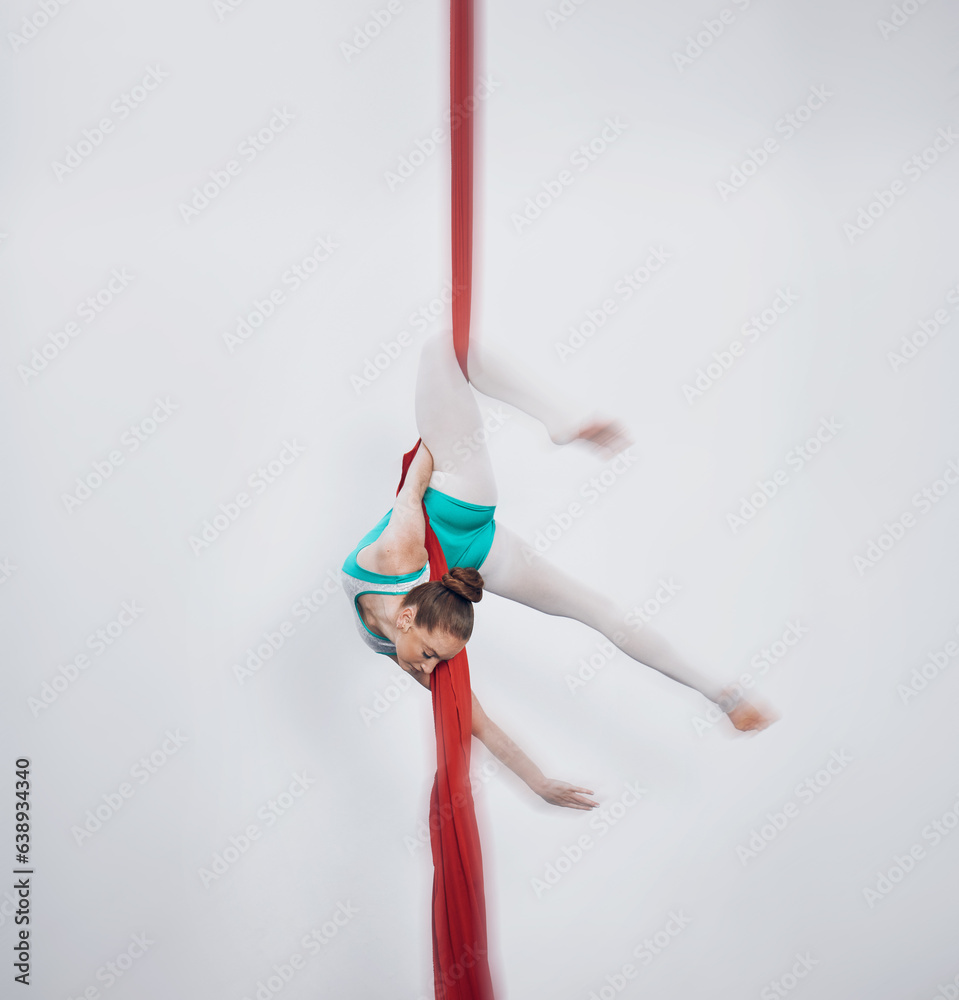 Gymnastics, acrobat and aerial silk with a sports woman in air for performance and balance. Young at