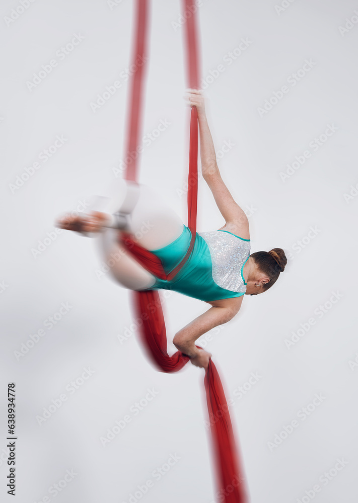 Aerial silk, acrobat and a woman in air for gymnastics performance, sports and balance. Behind athle