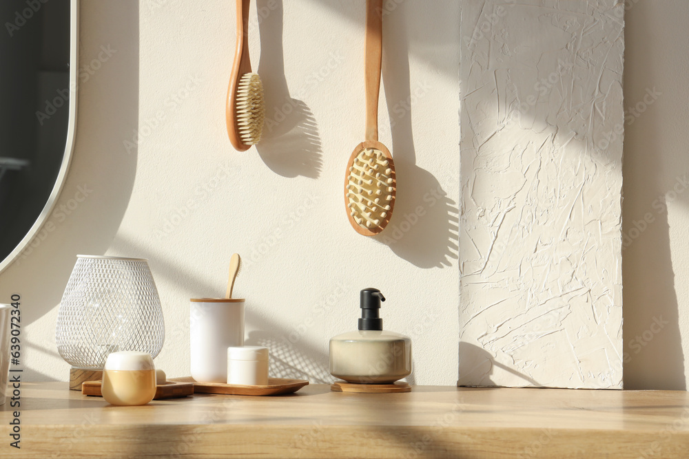 Bath accessories with lamp on table in bathroom