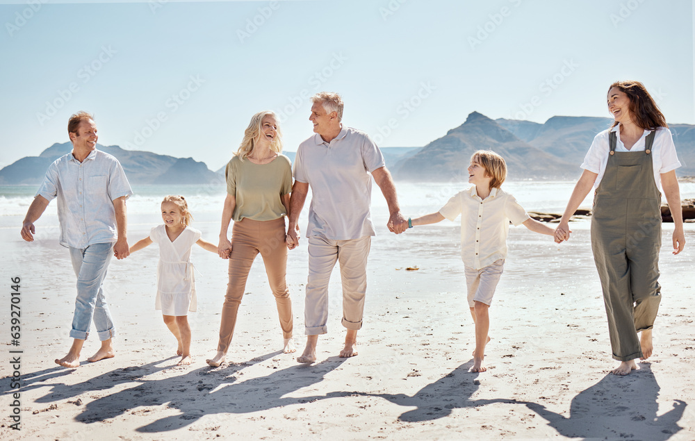 Happy, walking and big family holding hands at the beach on vacation, holiday or adventure together.