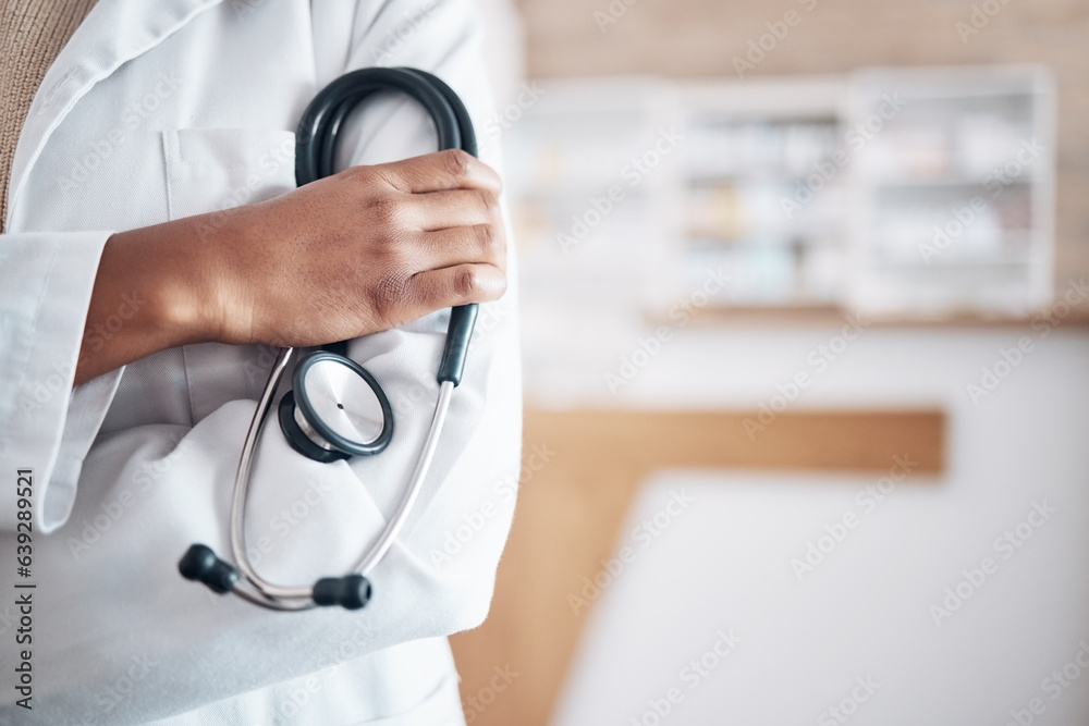 Hands, doctor and arms crossed with stethoscope in hospital, surgery and trust. Closeup of medical w