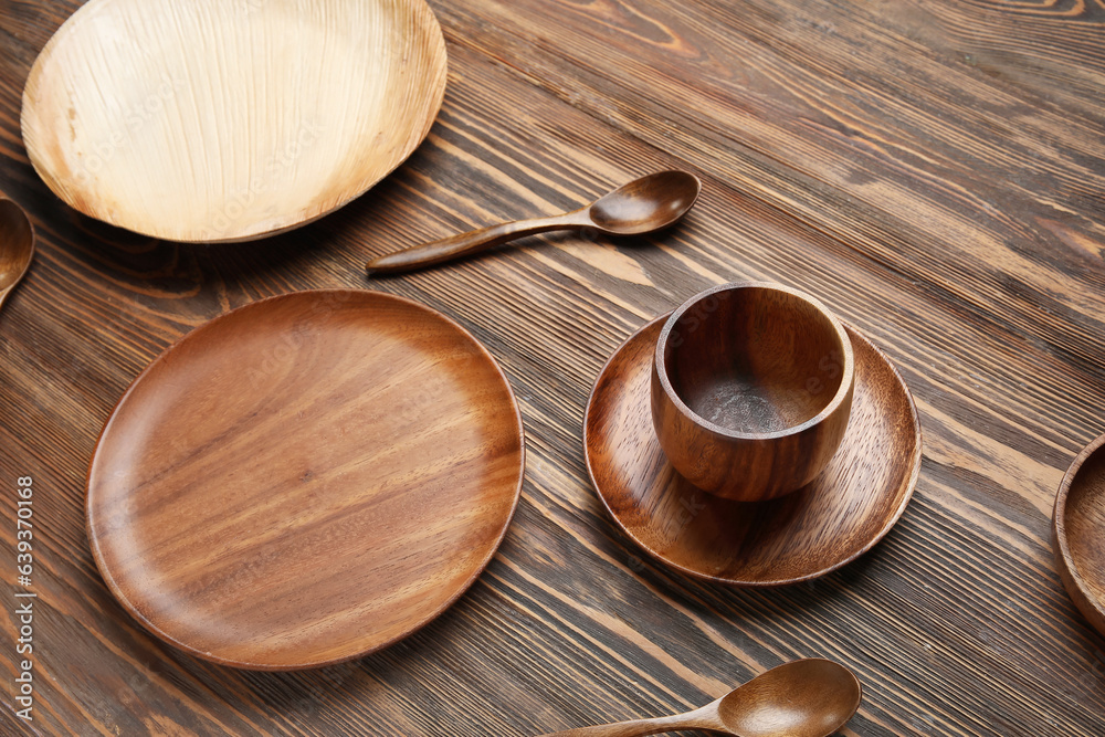 Different tableware on wooden background, closeup