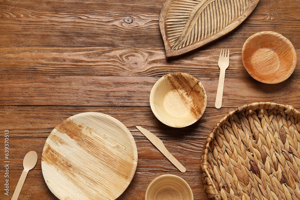 Different tableware on wooden background