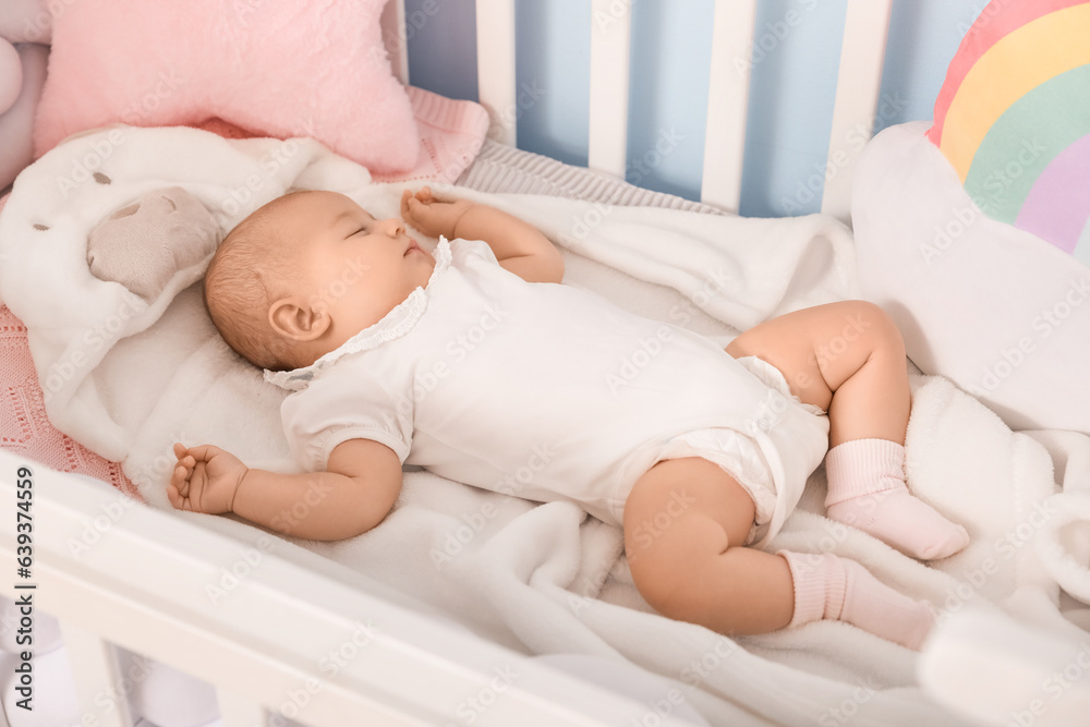 Cute baby lying in crib