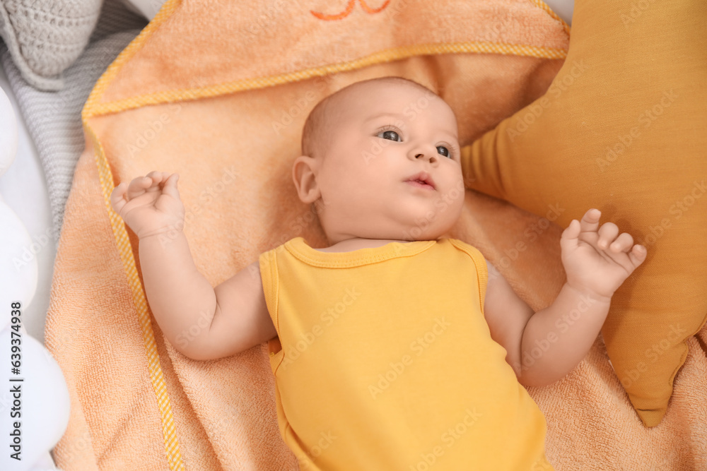 Cute baby lying in crib, closeup