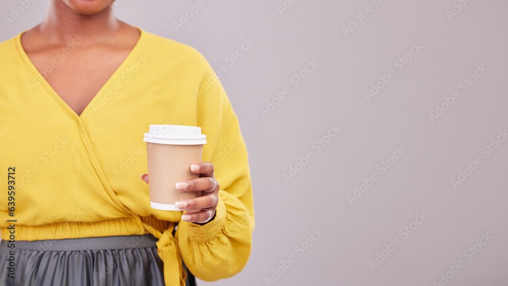 Hand, coffee and mockup with a woman in studio on a gray background for morning caffeine in a cup. C