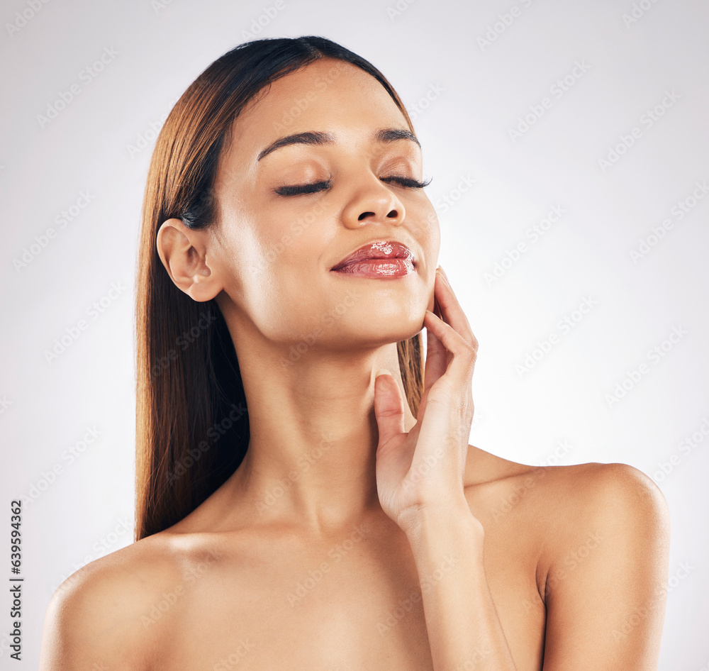 Woman, touching face and natural beauty in a studio, wellness and dermatology isolated on white back