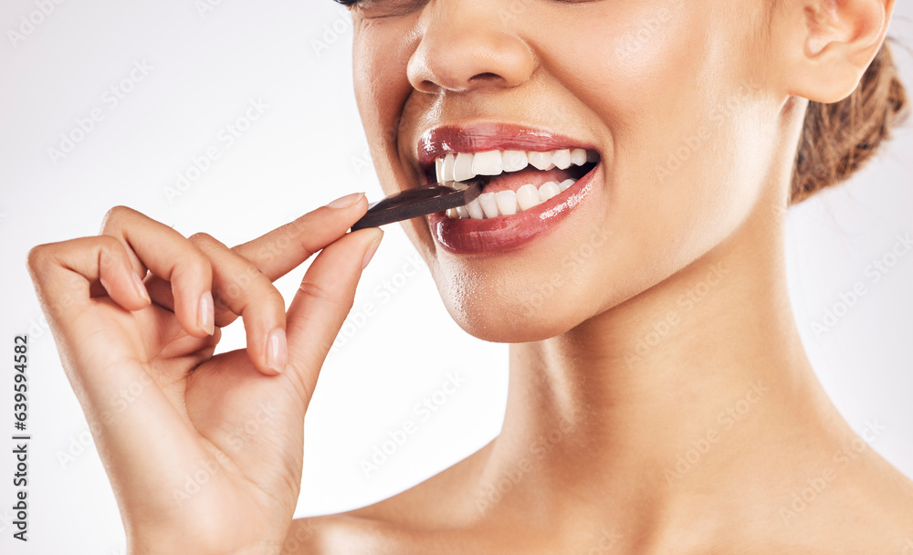 Woman, chocolate and mouth for eating, studio and healthy with nutrition, diet and bite by white bac