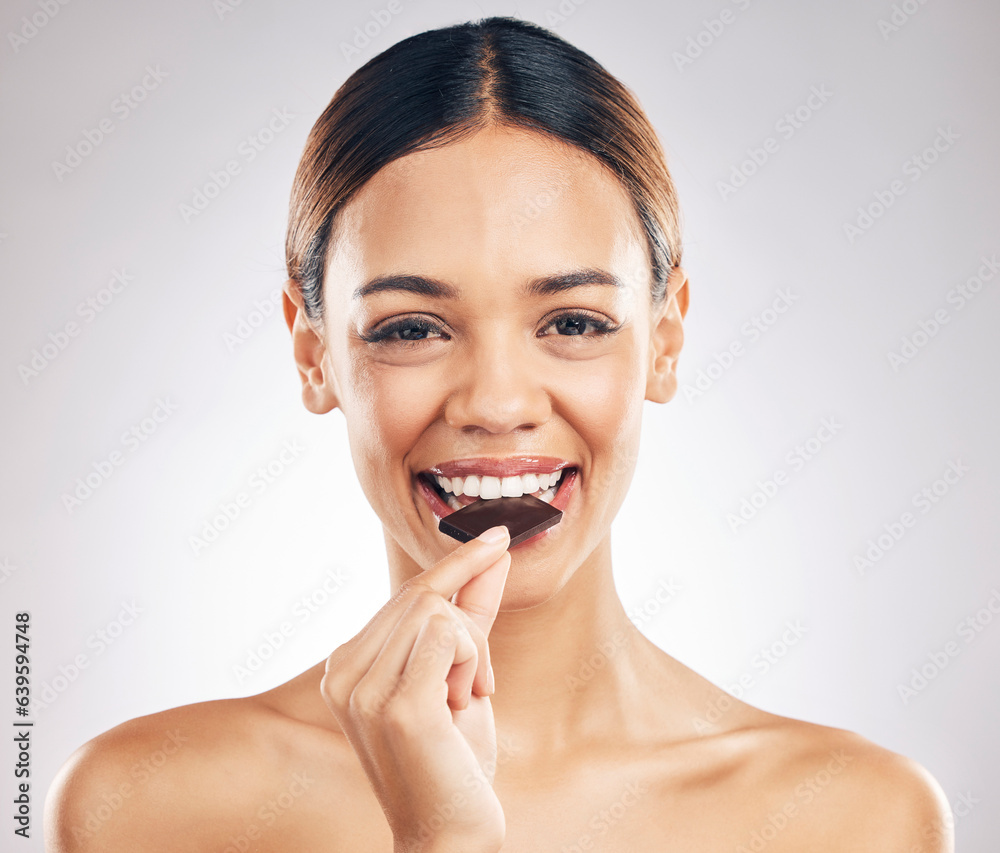 Woman, eating chocolate and portrait for skincare, beauty and wellness, health or diet on white back