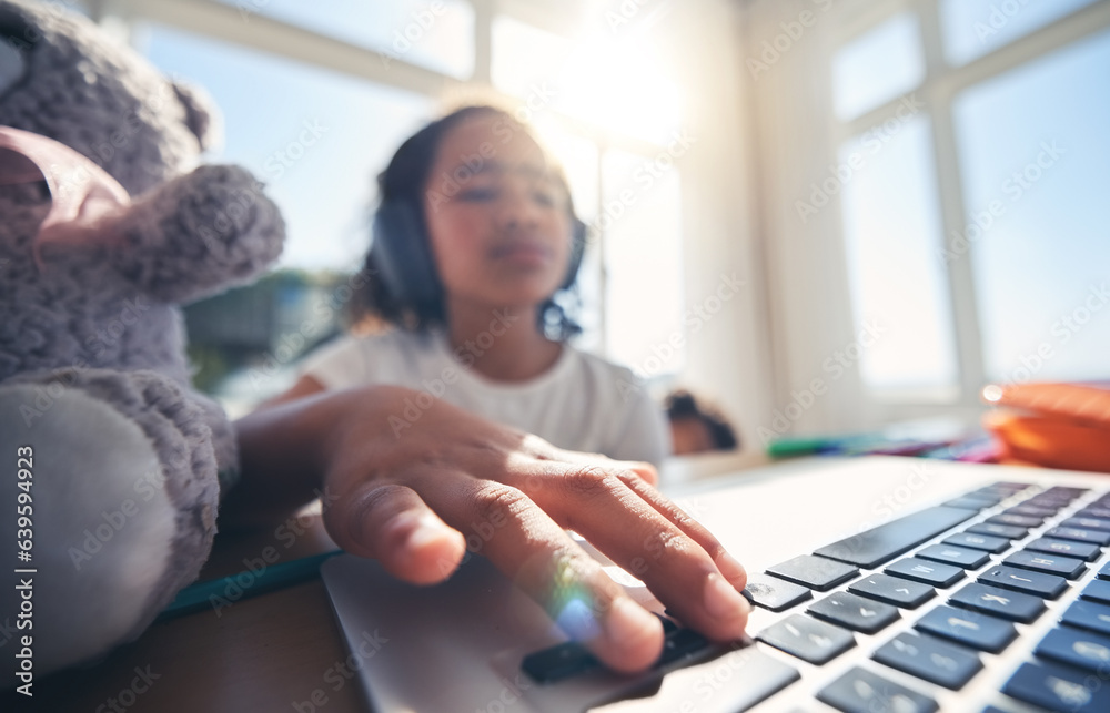 Hand, laptop and homework with a girl in her bedroom for remote learning or private home school. Com