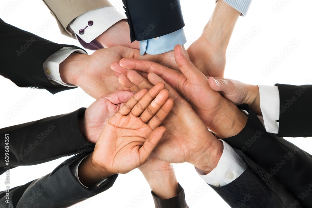 Confident Business Team Stacking Hands While Standing In Huddle