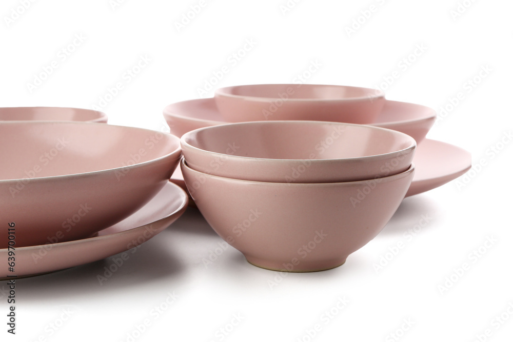 Set of different pink plates on white background, closeup