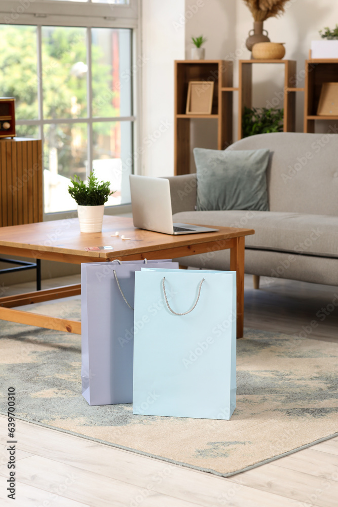 Shopping bags in interior of living room