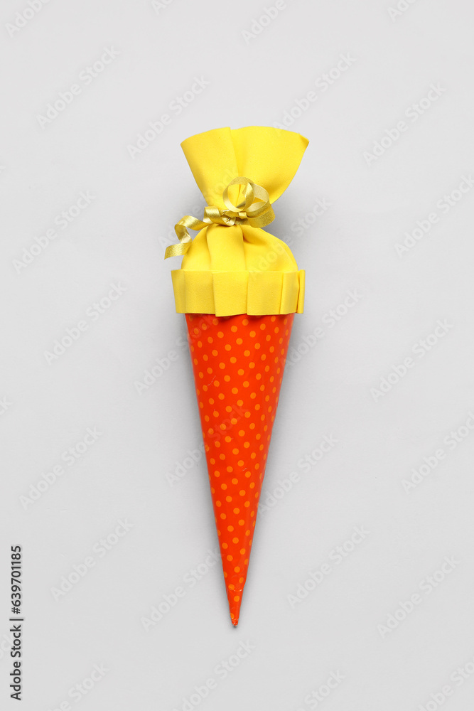 Yellow school cone on grey background