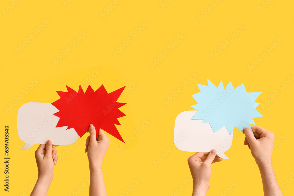 Different hands with speech bubbles on yellow background