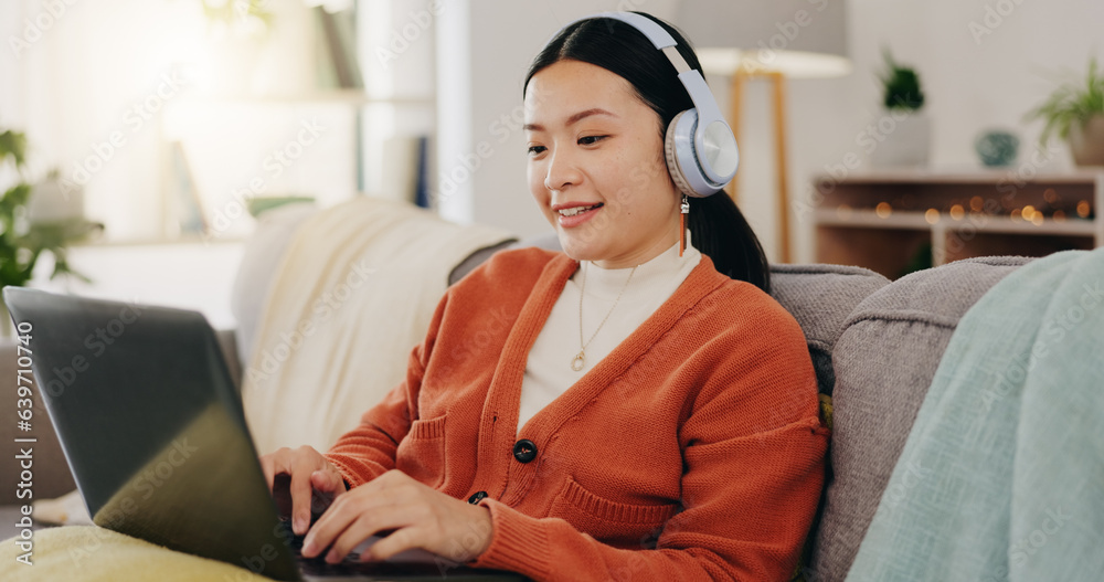 Laptop, headphones and asian woman on couch with work from home opportunity in online or website cop